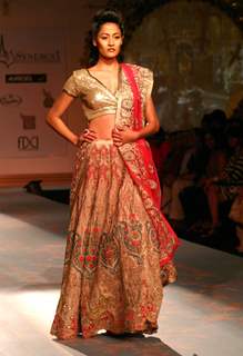 Model walks the ramp for designer Varun Bhal's creation at the Synergy one Delhi Couture Week