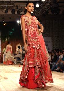 A model showcasing designers Shantanu & Nikhil's creation at the Synergy one Delhi Couture Week,in New Delhi