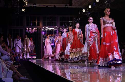 Models showcasing designer Manish Malhotra's creations at Synergy1 Delhi Couture Week,in New Delhi