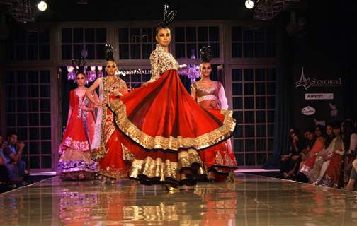 Models showcasing designer Manish Malhotra's creations at Synergy1 Delhi Couture Week,in New Delhi