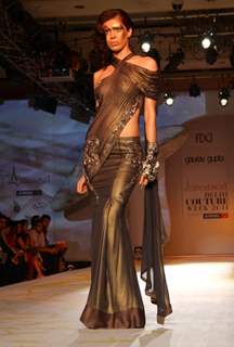 A model showcasing designer Gaurav Gupta's creation at the Synergy1 Delhi Couture Week,in New Delhi