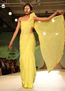 A model showcasing designer Gaurav Gupta's creation at the Synergy1 Delhi Couture Week,in New Delhi