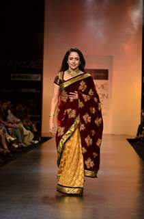 Hema Malini display creations by designers Bhumika and Shyamal during Lakme Fashion Week Day 3 in Mumbai. .