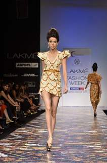 Model displays designer Pria Kataria Puri's creation during the Lakme Fashion Week Day 3 in Mumbai. .