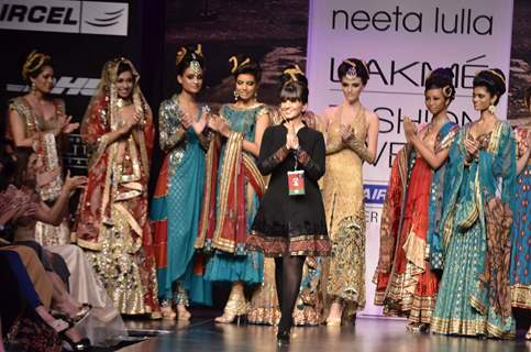Models with designer Neeta Lulla during the Lakme Fashion Week Day 4 in Mumbai. .