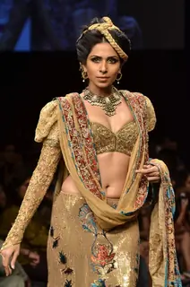 Model displays designer Neeta Lulla's creation during the Lakme Fashion Week Day 4 in Mumbai. .