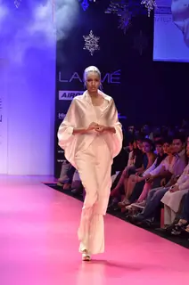 Model displays designer Wendell Rodricks's creation during the Lakme Fashion Week Day 4 in Mumbai. .
