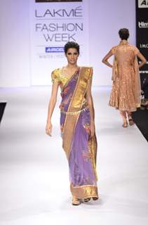 Model displays designer Preeti S. Kapoor's creation during the Lakme Fashion Week Day 5 in Mumbai. .