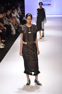 Model displays designer Kallol Datta's creation during the Lakme Fashion Week Day 5 in Mumbai. .