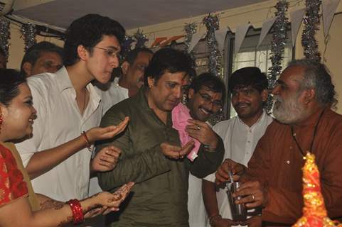 Govinda paying devote to Lord Ganesha during the occasion of Ganesh Chaturthi at their home