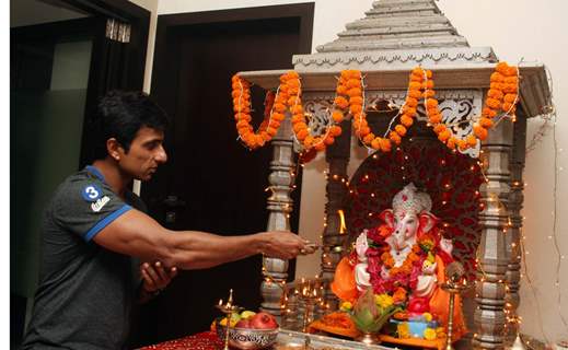 Sonu Sood paying devote to Lord Ganesha during the occasion of Ganesh Chaturthi at their home