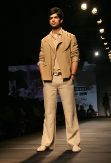 A model showcasing designer Tarun Tahiliani's creation at the Ven Heusen India Mens Week 2011, in New Delhi on Friday. .