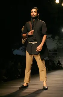 A model showcasing designer Tarun Tahiliani's creation at the Ven Heusen India Mens Week 2011, in New Delhi on Friday. .