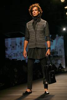 A model showcasing designer Tarun Tahiliani's creation at the Ven Heusen India Mens Week 2011, in New Delhi on Friday. .