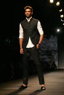 A model showcasing designer Tarun Tahiliani's creation at the Ven Heusen India Mens Week 2011, in New Delhi on Friday. .