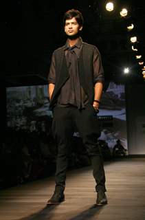 A model showcasing designer Tarun Tahiliani's creation at the Ven Heusen India Mens Week 2011, in New Delhi on Friday. .