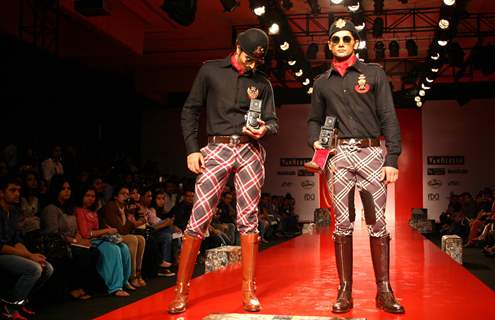 Models showcasing designer Arjun Khanna's creation at the Ven Heusen India Mens Week 2011, in New Delhi on Friday. .