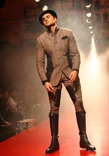 A model showcasing designer Arjun Khanna's creation at the Ven Heusen India Mens Week 2011, in New Delhi on Friday. .