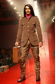 A model showcasing designer Arjun Khanna's creation at the Ven Heusen India Mens Week 2011, in New Delhi on Friday. .