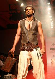 A model showcasing designer Arjun Khanna's creation at the Ven Heusen India Mens Week 2011, in New Delhi on Friday. .