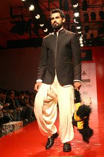 A model showcasing designer Arjun Khanna's creation at the Ven Heusen India Mens Week 2011, in New Delhi on Friday. .