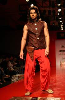 A model showcasing designer Arjun Khanna's creation at the Ven Heusen India Mens Week 2011, in New Delhi on Friday. .