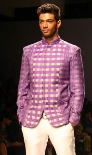 A model showcasing designer Manoviraj Khosla,s creation at the Van Heusen India Fashion Week,in New Delhi. .