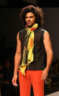 A model showcasing designer Manoviraj Khosla,s creation at the Van Heusen India Fashion Week,in New Delhi. .