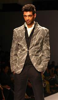 A model showcasing designer Manoviraj Khosla,s creation at the Van Heusen India Fashion Week,in New Delhi. .