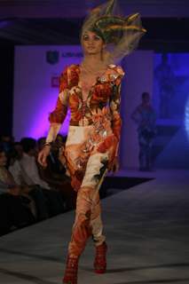 Model walks the ramp for WLC Chimera fashion show at Leela Hotel