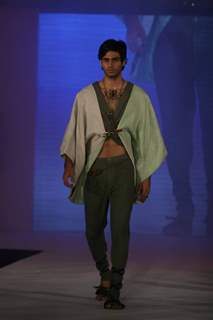 Model walks the ramp for WLC Chimera fashion show at Leela Hotel