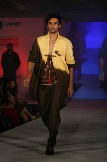 Model walks the ramp for WLC Chimera fashion show at Leela Hotel