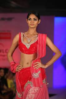 Model walks the ramp for WLC Chimera fashion show at Leela Hotel