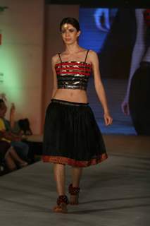 Model walks the ramp for WLC Chimera fashion show at Leela Hotel