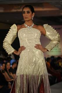 Model walks the ramp for WLC Chimera fashion show at Leela Hotel