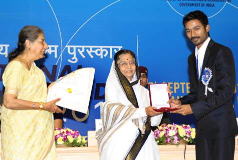 President Pratibha Devisingh Patil and Union Minister Ambika Soni  presenting the ''Best Actor Award'' to K. Dhanush at the 58 th National Film Awards 2010, in New Delhi. .