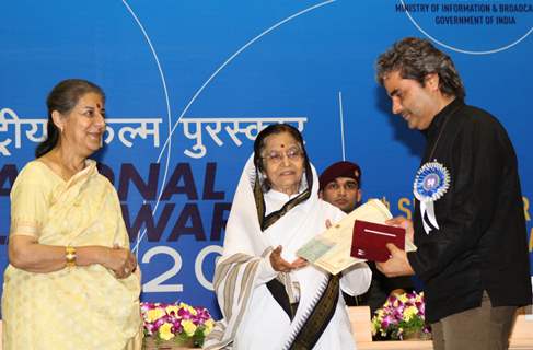 President Pratibha Devisingh Patil and Union Minister Ambika Soni  presenting the ''Best Music Direction(Songs) Award'' to Vishal Bhardwaj for  film ''Ishqiya