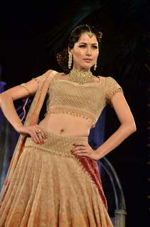 Model walks the ramp for Tarun Tahiliani show at Aamby Valley Fashion week. .