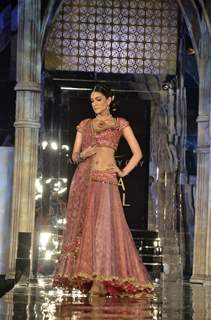 Model walks the ramp for Tarun Tahiliani show at Aamby Valley Fashion week. .