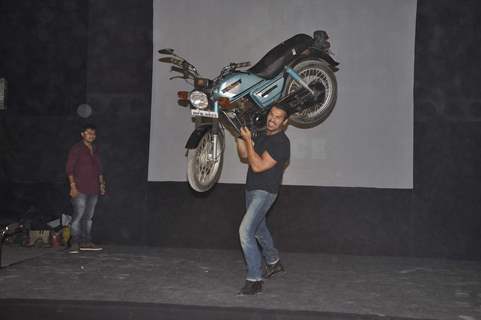 John Abraham lifts a bike at Force promotions in Mehboob, Mumbai