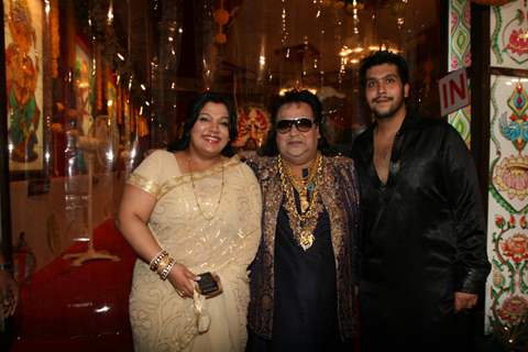 Bappi Lahiri with wife and son at Sarbojanin Durga Puja Pandal in Mumbai