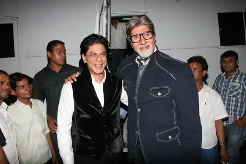 Amitabh Bachchan with Shah Rukh Khan on the sets of Kaun Banega Crorepati 5 in Mumbai