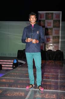 Milind Soman walks the ramp at Kingfisher Calendar Girl 2011 contest in Mumbai