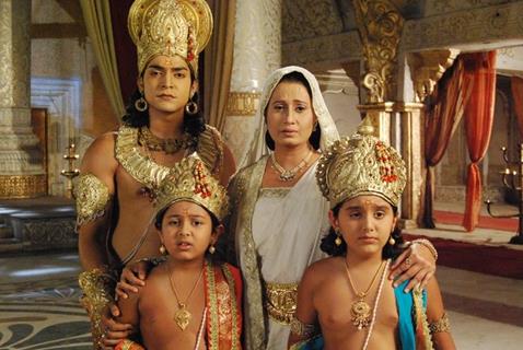 Lord Ram with his sons, Luv and Kush, and his mother Kaushalya