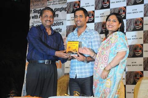 Mahendra Singh Dhoni with Y.P. singh and Abha Singh releasing the novel 'Carnage by Angels'