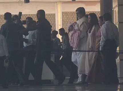 Amitabh Bachchan holds his granddaughter walking with Aishwarya leave the Seven Hills Hospital