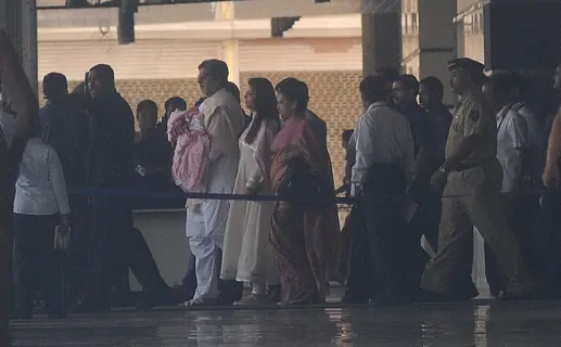 Amitabh Bachchan holds his granddaughter walking with Aishwarya leave the Seven Hills Hospital