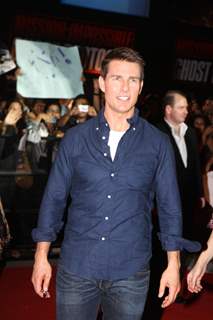 Tom Cruise poses for a photo before a special screening of film Mission Impossible at IMAX Wadala