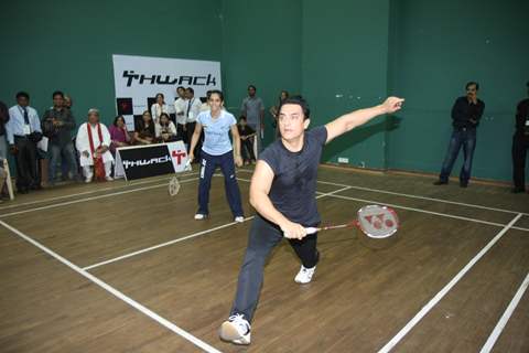 Aamir Khan and badminton ace Saina Nehwal play an exhibition match at launch of 'PULLELA GOPICHAND'Book in Mumbai