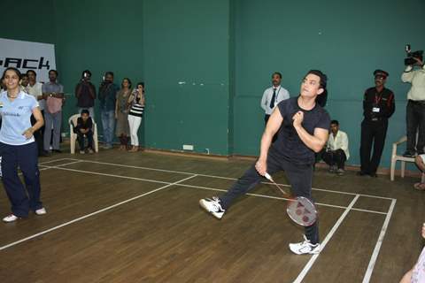 Aamir Khan and badminton ace Saina Nehwal play an exhibition match at launch of 'PULLELA GOPICHAND'Book in Mumbai